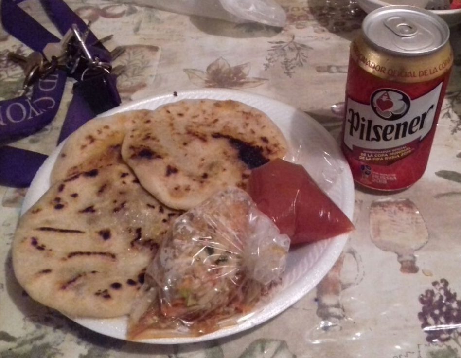 Red tomato sauce and pickled vegetables served with pupusas